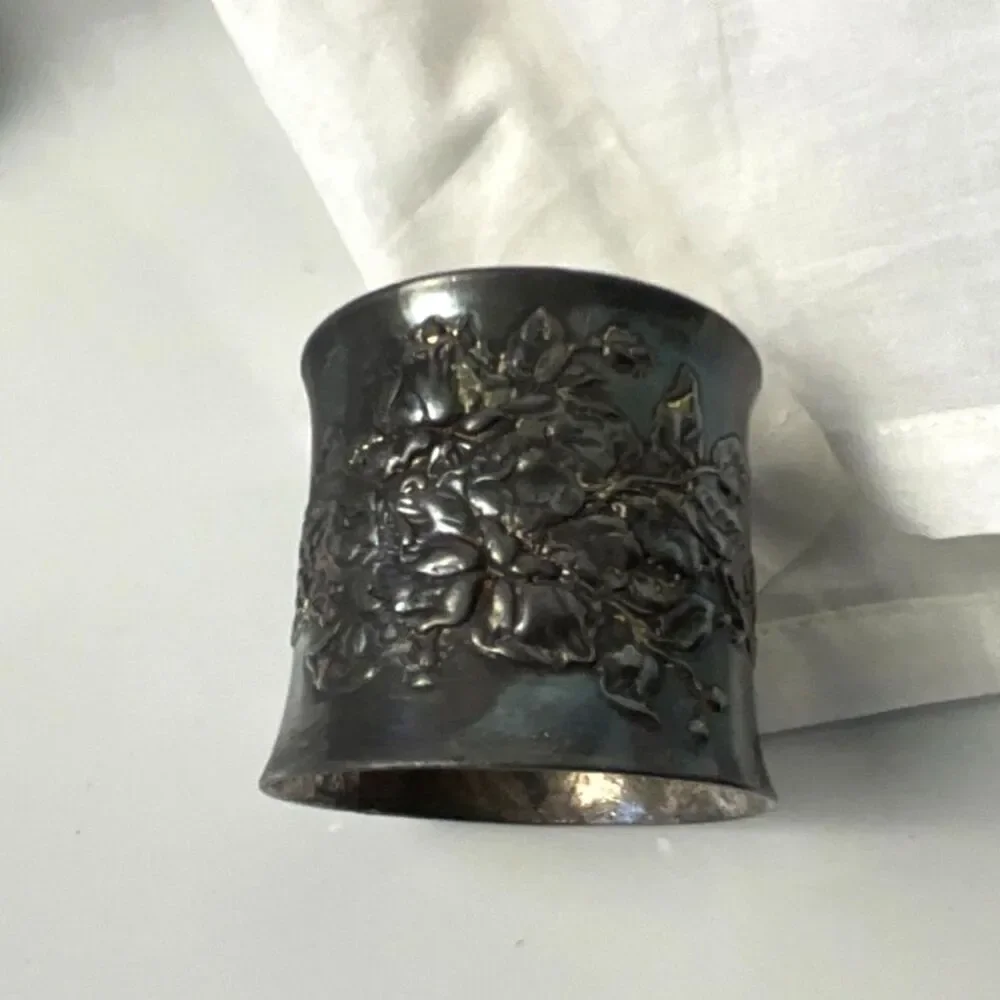 Gorgeous antique silver plated napkin ring; embossed flowers